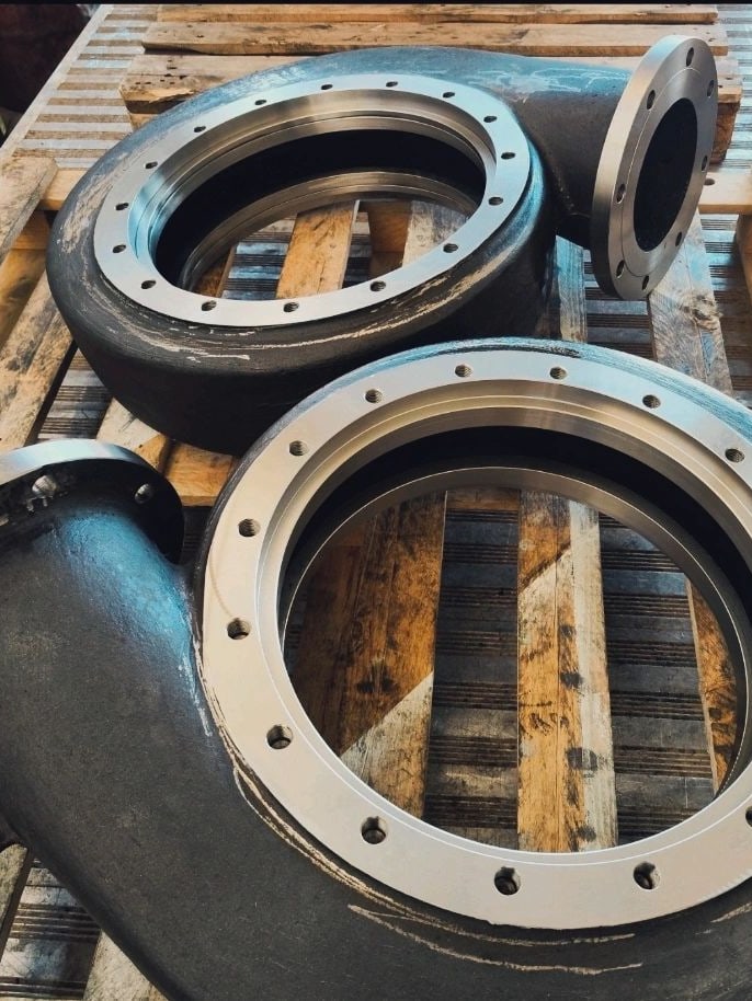 Two pump casings, cast and machined